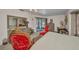 Spacious main bedroom featuring pool access, plush carpet, and vintage furnishings at 17210 Chase Ave, Port Charlotte, FL 33948