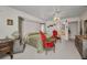 Bright main bedroom features neutral carpet, ceiling fan, and eclectic furniture and decor at 17210 Chase Ave, Port Charlotte, FL 33948