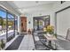 Enclosed patio featuring tiled floors, and metal patio furniture with access to an outside pool at 17210 Chase Ave, Port Charlotte, FL 33948