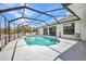 Backyard swimming pool with screened enclosure and clear blue skies above at 17210 Chase Ave, Port Charlotte, FL 33948