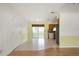 Open kitchenette features a sliding glass door and tile floor at 18103 Clanton Ave, Port Charlotte, FL 33948