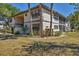 Exterior of a multi-unit condo building with landscaping at 19505 Quesada Ave # Qq101, Port Charlotte, FL 33948