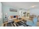 Inviting living room featuring a comfortable seating area, dining space, and views to the kitchen at 19505 Quesada Ave # Qq101, Port Charlotte, FL 33948