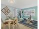 Comfortable living space featuring a dining area and sitting area with bright, natural light at 19505 Quesada Ave # Qq101, Port Charlotte, FL 33948