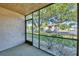 Screened patio featuring a view of well-maintained landscaping at 19505 Quesada Ave # Qq101, Port Charlotte, FL 33948