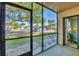 Enclosed back patio with view of green common area at 19505 Quesada Ave # Qq101, Port Charlotte, FL 33948