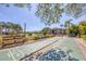 Community shuffleboard court with benches and manicured landscaping offers a fun recreational amenity at 19505 Quesada Ave # Qq101, Port Charlotte, FL 33948