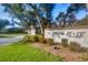 Community sign with lush landscaping at 19505 Quesada Ave # Qq101, Port Charlotte, FL 33948