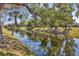 Scenic water view showcases lush landscaping and tranquil canal creating a peaceful atmosphere at 19505 Quesada Ave # Qq101, Port Charlotte, FL 33948