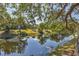 Beautiful canal view with lush landscaping providing a serene and tranquil environment at 19505 Quesada Ave # Qq101, Port Charlotte, FL 33948