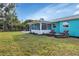 Backyard with screened in porch and lounge chairs at 20238 Banner Ave, Port Charlotte, FL 33952