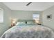 Bright bedroom with a ceiling fan and bedside lamps at 20238 Banner Ave, Port Charlotte, FL 33952