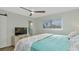 Bedroom featuring a ceiling fan, a sliding barn door, and a window at 20238 Banner Ave, Port Charlotte, FL 33952