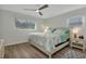 Bedroom with natural light, ceiling fan, and wood floors at 20238 Banner Ave, Port Charlotte, FL 33952