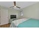 Bedroom with a ceiling fan, a TV, and a door to the bathroom at 20238 Banner Ave, Port Charlotte, FL 33952