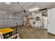 View of garage with painted floor, paint buckets and garage door at 20238 Banner Ave, Port Charlotte, FL 33952