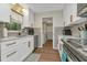 Charming kitchen with stainless steel appliances, white cabinets, and modern countertops at 20238 Banner Ave, Port Charlotte, FL 33952
