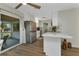 Kitchen with white cabinets, white quartz countertops, stainless appliances, and breakfast bar seating at 20238 Banner Ave, Port Charlotte, FL 33952