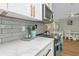 Stylish kitchen featuring quartz countertops, stainless steel oven, and modern backsplash at 20238 Banner Ave, Port Charlotte, FL 33952