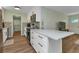 Bright kitchen featuring white cabinetry, modern appliances, and a quartz countertop island at 20238 Banner Ave, Port Charlotte, FL 33952