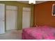 Bedroom showcasing a large closet and artistic decor at 21161 Knollwood Ave, Port Charlotte, FL 33952