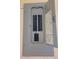 A gray, open electrical panel shows rows of circuit breakers at 21161 Knollwood Ave, Port Charlotte, FL 33952