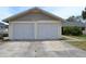 Attached two-car garage offering ample parking and storage space at 21161 Knollwood Ave, Port Charlotte, FL 33952