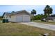 Home exterior showcasing the two car garage and driveway at 21161 Knollwood Ave, Port Charlotte, FL 33952