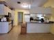 Spacious kitchen with a view of the standard appliances and white cabinets at 21161 Knollwood Ave, Port Charlotte, FL 33952