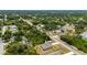 An aerial view highlighting the property's location within a lush, green neighborhood at 21310 Quesada Ave, Port Charlotte, FL 33952