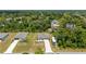 An aerial view highlighting the property's location within a lush, green neighborhood at 21310 Quesada Ave, Port Charlotte, FL 33952
