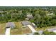 An aerial view highlighting the property's location within a lush, green neighborhood at 21310 Quesada Ave, Port Charlotte, FL 33952