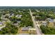 An aerial view highlighting the property's location within a lush, green neighborhood at 21310 Quesada Ave, Port Charlotte, FL 33952