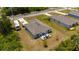 Aerial view showcasing the home's backyard deck and serene surroundings at 21310 Quesada Ave, Port Charlotte, FL 33952