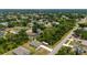 A beautiful aerial view of the home showcases its expansive lot, RV parking and proximity to the neighborhood at 21310 Quesada Ave, Port Charlotte, FL 33952