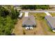 Aerial view showcasing the home's backyard deck and serene surroundings at 21310 Quesada Ave, Port Charlotte, FL 33952