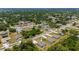 An aerial view highlighting the property's location within a lush, green neighborhood at 21310 Quesada Ave, Port Charlotte, FL 33952