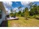 Backyard patio with outdoor seating and grill, perfect for outdoor enjoyment at 21310 Quesada Ave, Port Charlotte, FL 33952