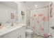 Bathroom featuring flamingo-themed decor and a vanity with a white countertop at 21310 Quesada Ave, Port Charlotte, FL 33952