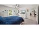 Bright bedroom features a ceiling fan, a window and charming coastal-themed decor at 21310 Quesada Ave, Port Charlotte, FL 33952
