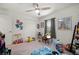 Bright bedroom offers neutral carpet and playful decor and toys at 21310 Quesada Ave, Port Charlotte, FL 33952