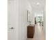 Bright hallway with tile flooring, leading to open living space with natural light at 21310 Quesada Ave, Port Charlotte, FL 33952