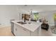 Bright kitchen with island seating, sleek countertops, and an open layout at 21310 Quesada Ave, Port Charlotte, FL 33952