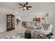 Comfortable living room with a sectional sofa, patterned rug, and seamless flow to the modern kitchen at 21310 Quesada Ave, Port Charlotte, FL 33952