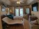 Spacious bedroom with a ceiling fan, walk-out to lanai, and ample natural light at 2250 Charleston Park Dr, North Port, FL 34287