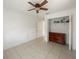 Bright bedroom featuring tile flooring, a closet, and a ceiling fan providing great light at 2336 Redfern St, Port Charlotte, FL 33948