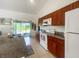 Well-appointed kitchen featuring granite counters, modern appliances, and tile flooring at 2336 Redfern St, Port Charlotte, FL 33948