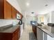 Bright kitchen with granite countertops, stainless steel appliances, and a breakfast bar at 2336 Redfern St, Port Charlotte, FL 33948