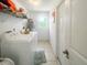 Bright laundry room featuring a washer and dryer set, shelving, and a window at 2336 Redfern St, Port Charlotte, FL 33948