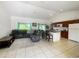 Open-concept living room and kitchen area, with modern tile flooring and plenty of natural light at 2336 Redfern St, Port Charlotte, FL 33948